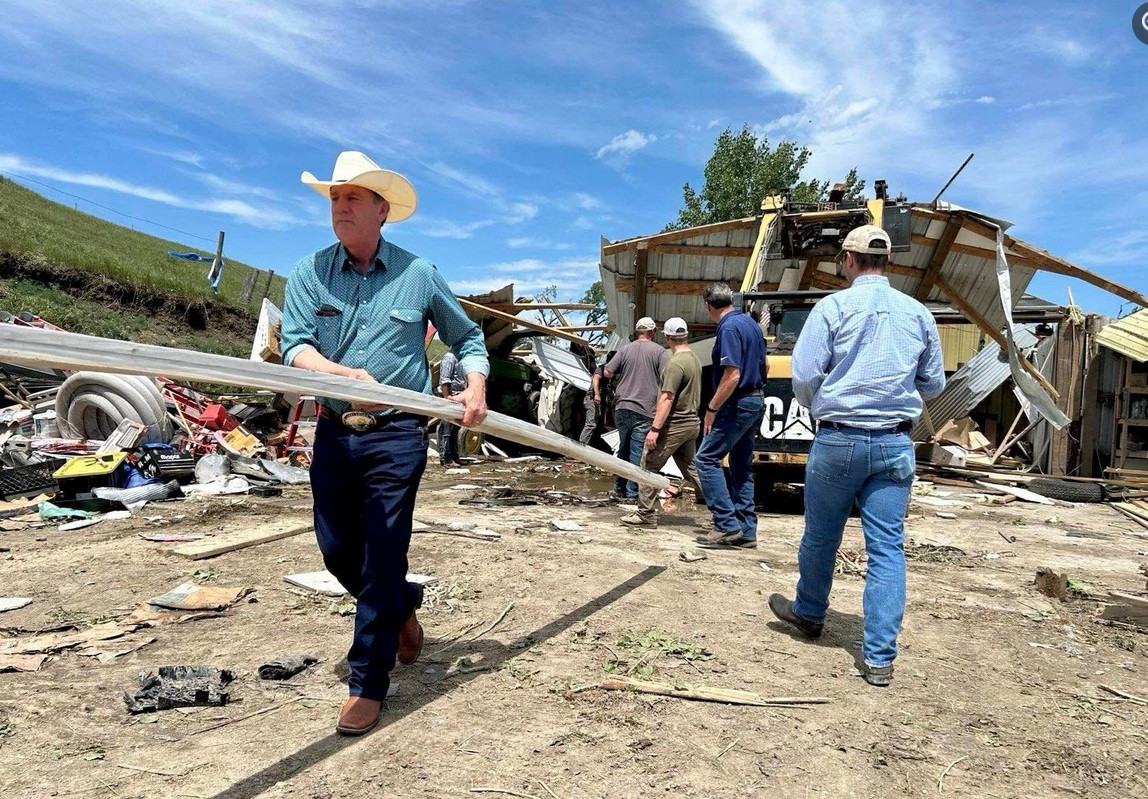 State’s Governor roles up his sleeves to help tornado victims