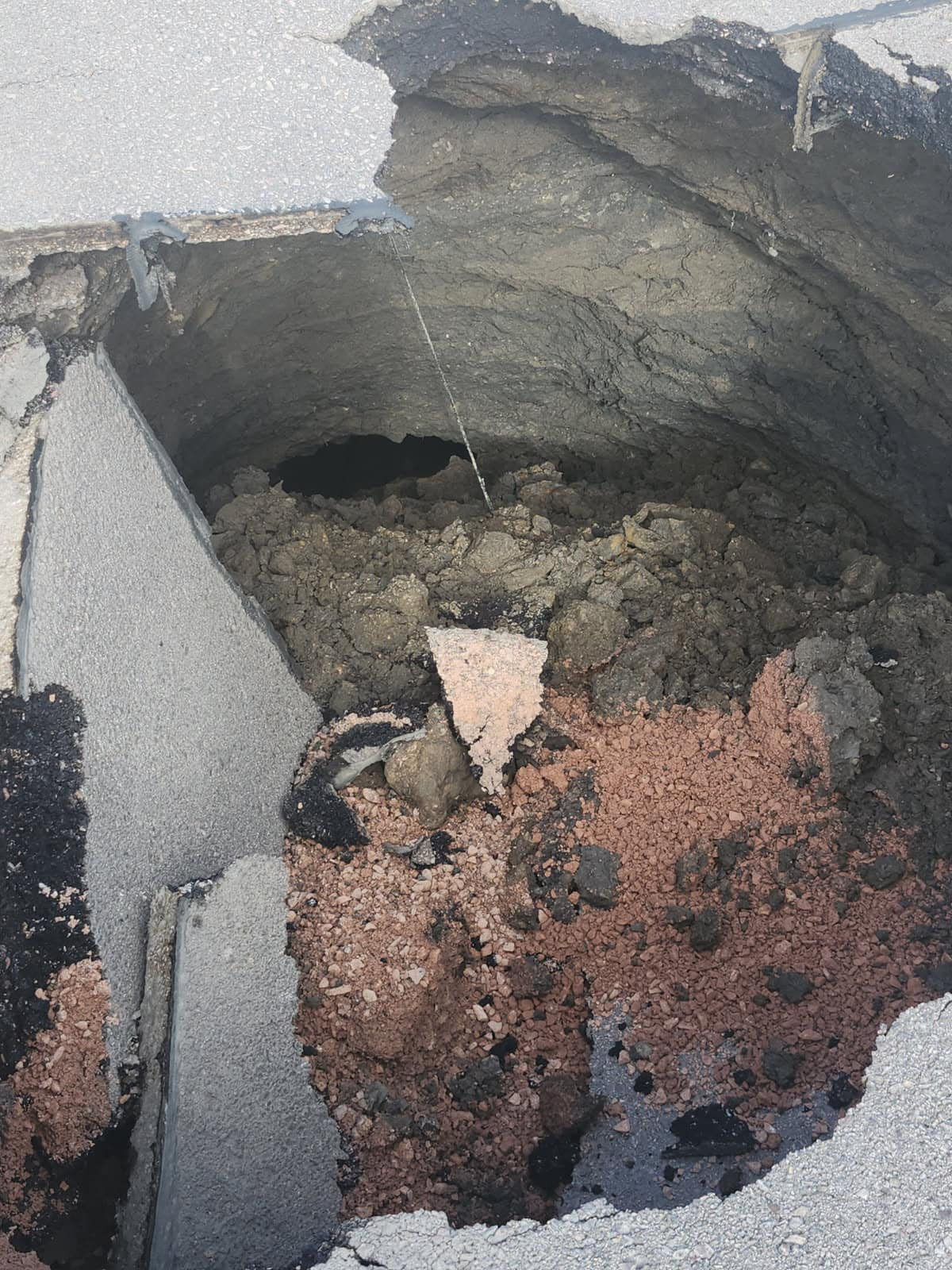 STREET CREWS ON SCENE OF SINK HOLE ON N. MAPLE AVENUE