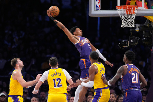Suns snap Lakers’ 7-game winning streak with 125-108 victory despite Booker’s early exit
