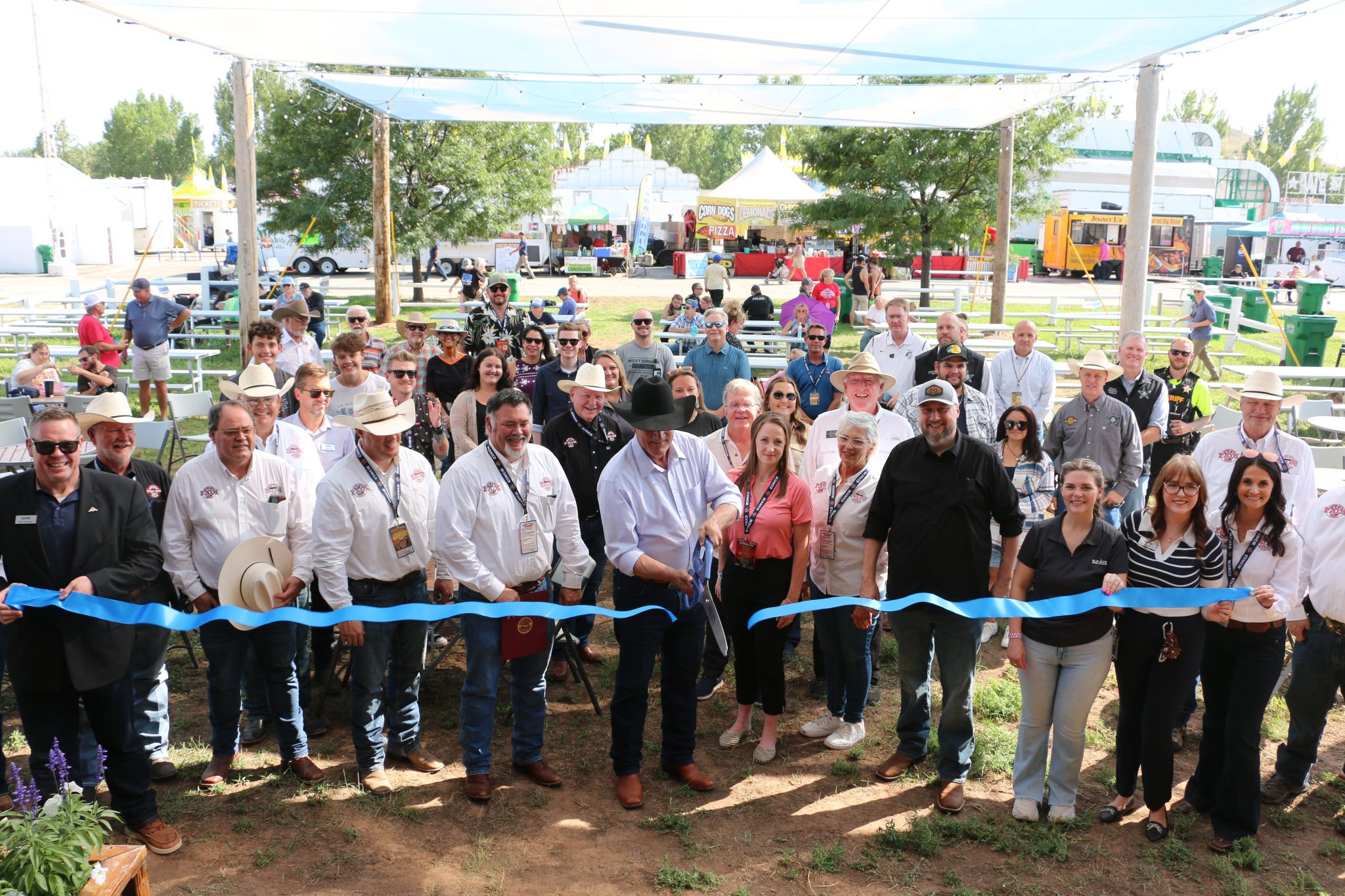 Ribbon cutting rings in Central States Fair