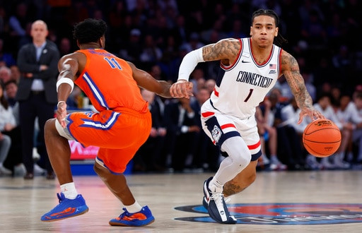 Ball scores 19 points as No. 5 UConn beats No. 18 Florida 77-73 in Jimmy V Classic