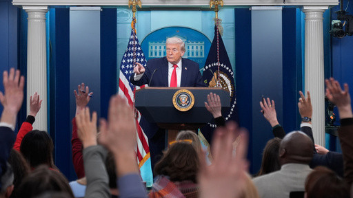 Trump recaps his first year back in office with winding remarks, paper tossing and impressions