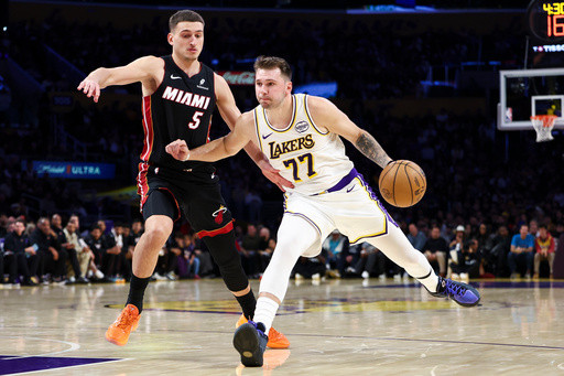 Lakers beat Heat 130-120 behind Doncic’s triple-double