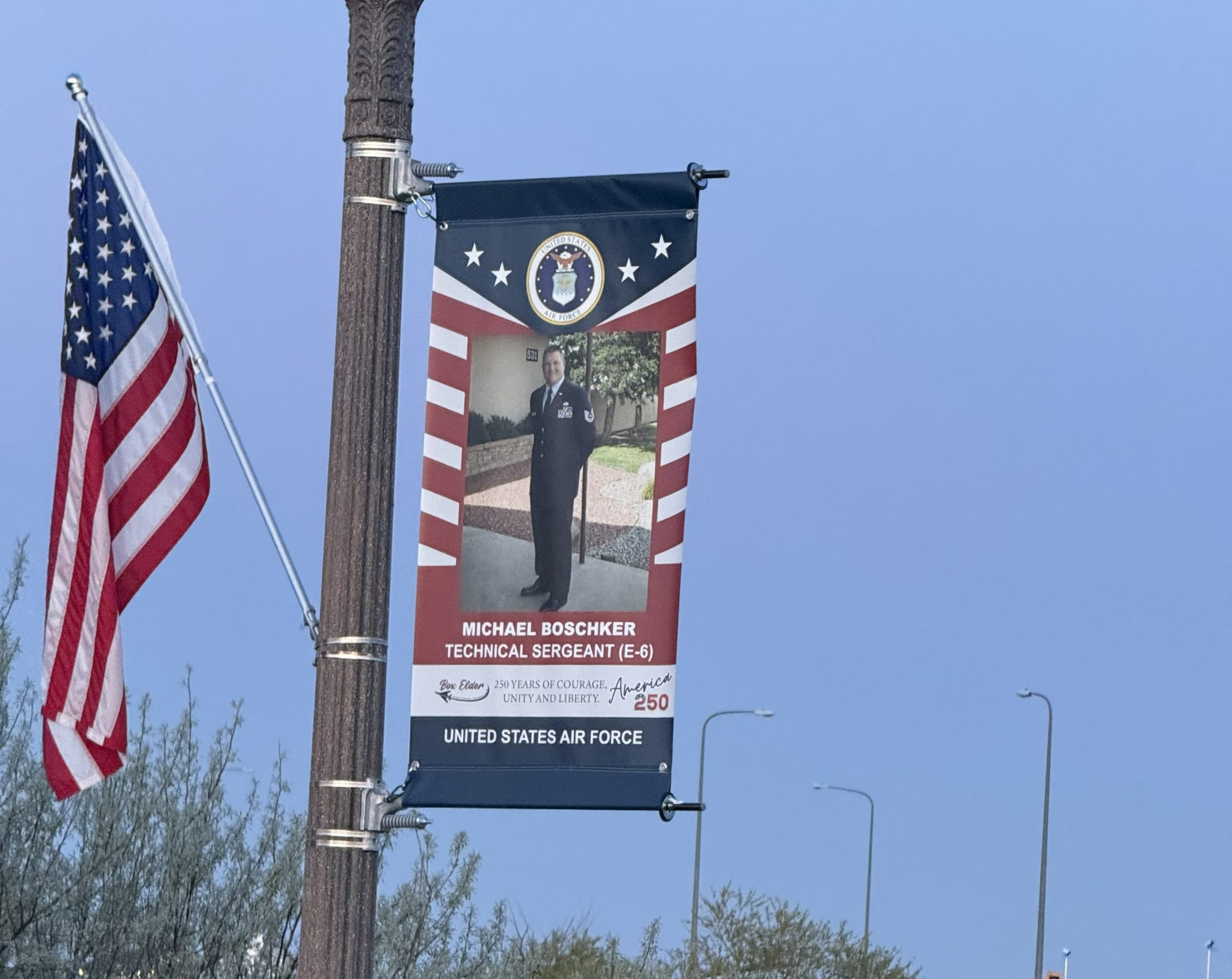 Military Banners Honoring Veterans Displayed Along Villa Drive In Box Elder