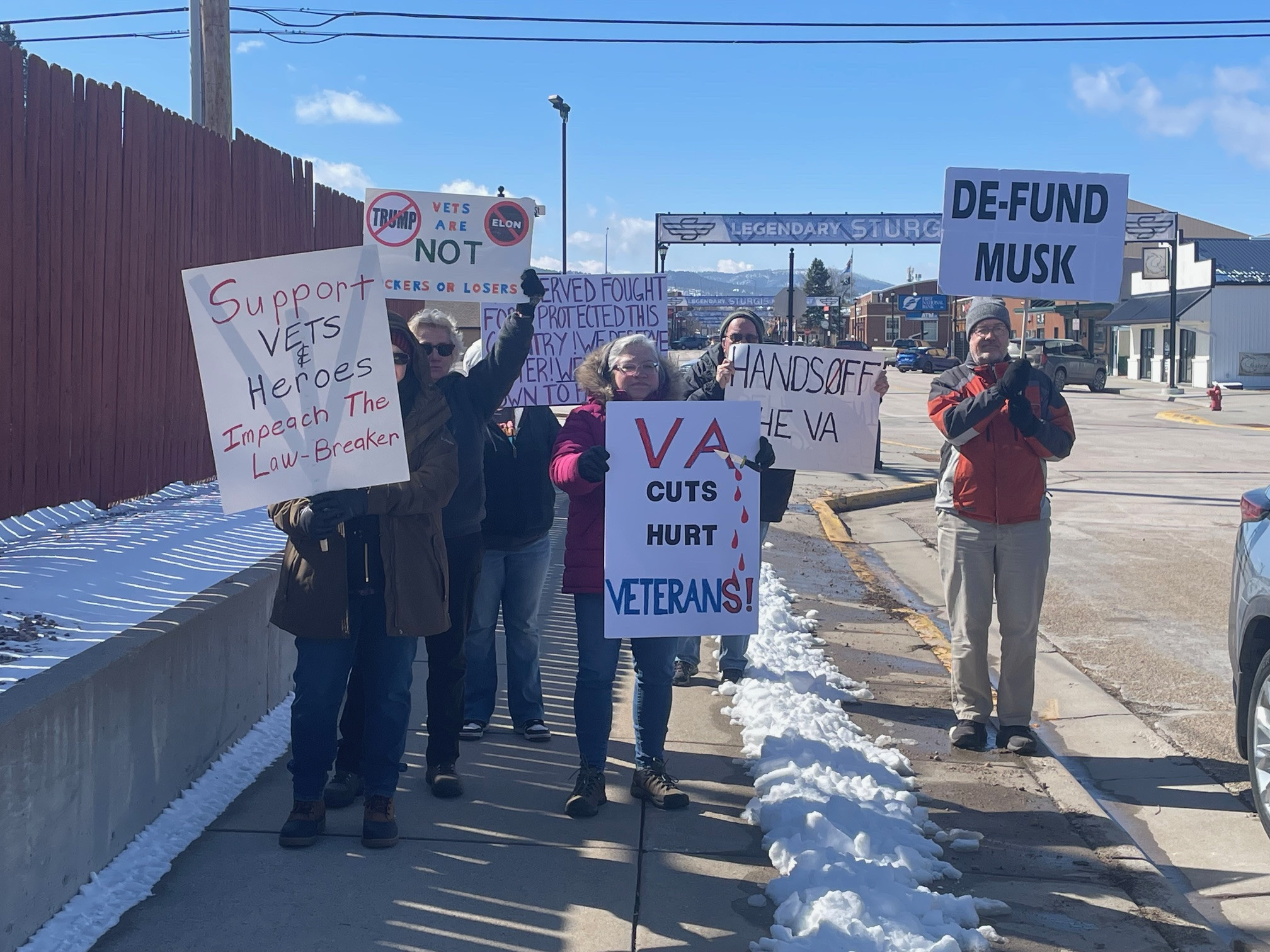 Protestors attend Dusty Johnson’s Black Hills visits