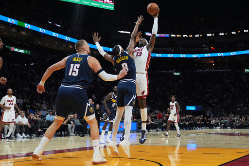 Nuggets star Nikola Jokic hurts left knee, limps off court at halftime in Miami