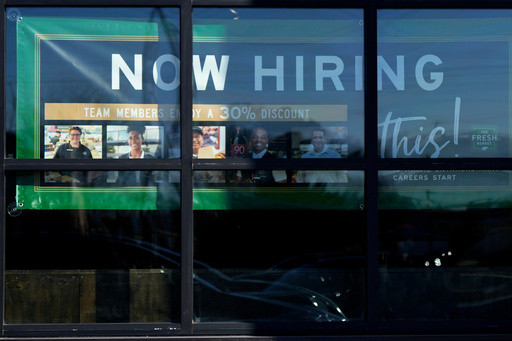 US applications for jobless benefits inch up last week to a still-low 200,000