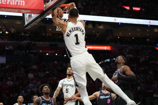 Wembanyama scores 26, red-hot Spurs roll past sliding Heat 136-111 and clinch Southwest Division
