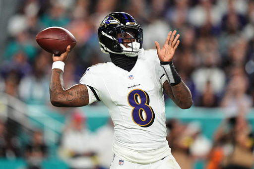 Lamar Jackson torches Miami with 4 TD passes in return from injury and Ravens rout Dolphins 28-6