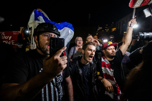 Photos of the mixed reactions to Trump’s bid to deploy troops to more US cities