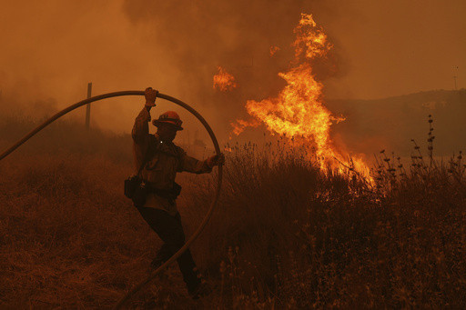 Firefighters make progress against blaze that forced thousands to flee north of Los Angeles