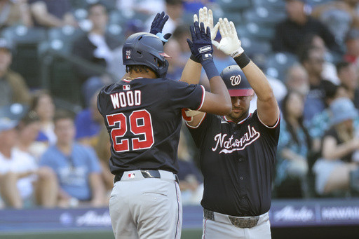 Hassell hits 1st major league homer and Nationals rout Mariners 9-0