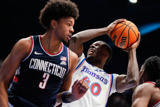 Freshman guard Braylon Mullins scores 17 points as No. 5 UConn rallies past No. 21 Kansas 61-56
