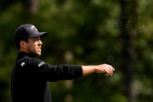 Schauffele’s drive appears to land in a viewer’s merchandise bag. It didn’t stop him from making par