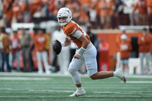 Manning throws 3 touchdowns and No. 20 Texas holds off No. 9 Vanderbilt late for 34-31 win
