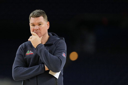 Arizona coach stays and Michigan awaits the Wildcats for heavyweight game at a distracted Final Four