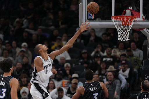 Wembanyama fuels early surge in late start as Spurs overcome travel woes to beat Magic