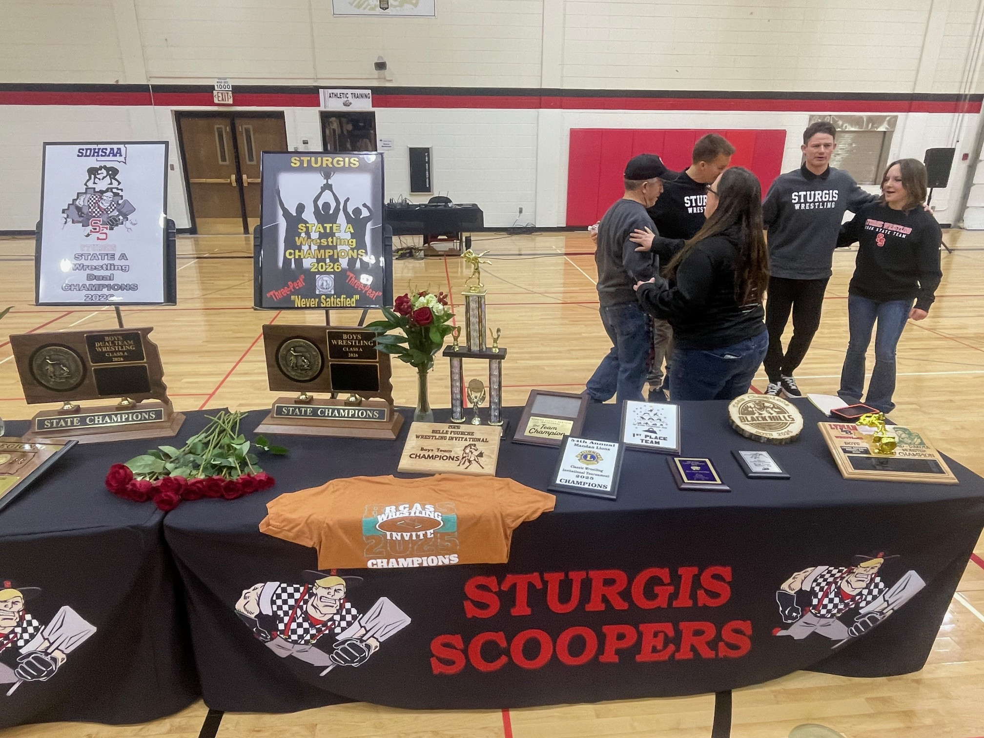 Community welcomes home State Champion Scooper Wrestling Team