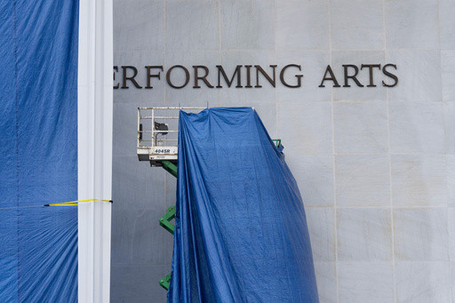 Photos of Trump’s name being added to the Kennedy Center