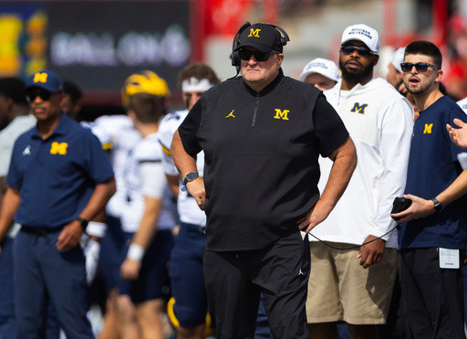 Poggi tells Michigan signees and parents to expect a new coach by end of month, AP source says