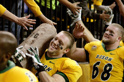 Origin stories behind the trophies heighten college football rivalry games on the smaller stage