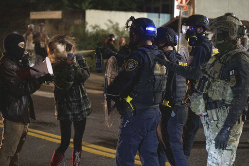 Portland braces for federal troops as protests escalate and a conservative influencer is arrested