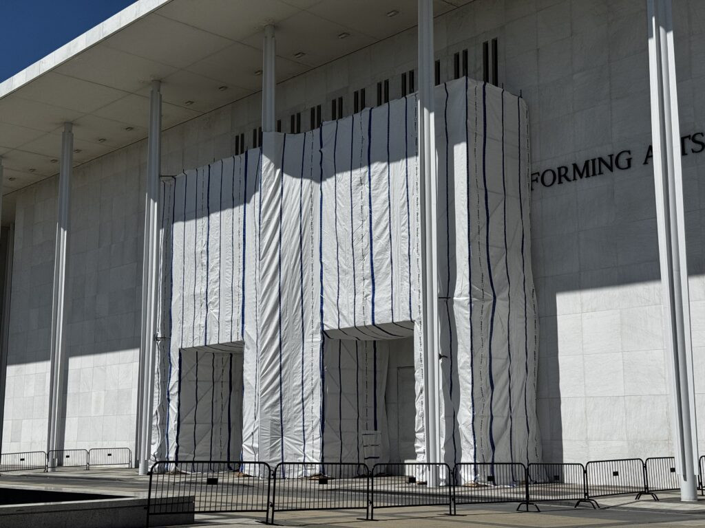 Kennedy Center facade blocked from public view by tarp after Trump’s name removed