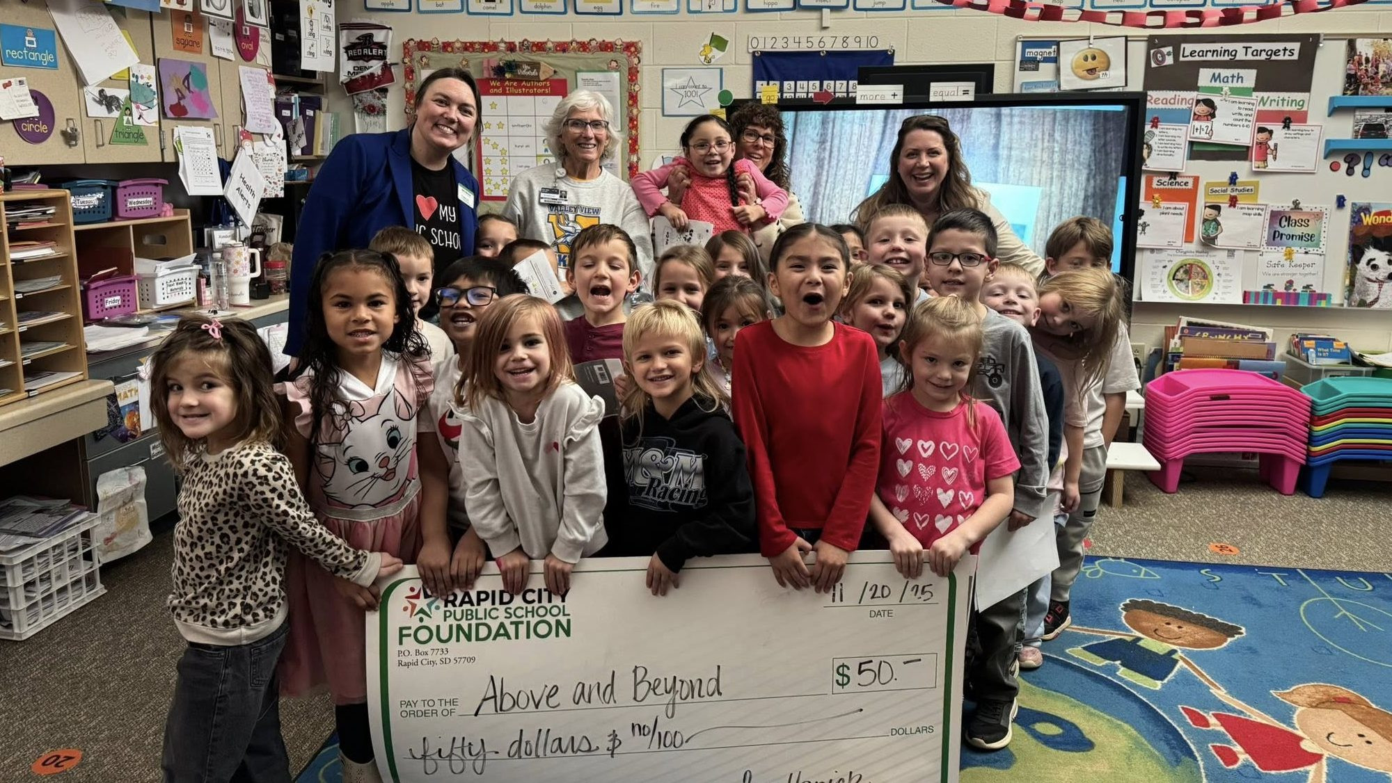 Above and Beyond Gives to Forty Local School Employees