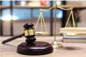 Woman charged in connection with remains in hotel room