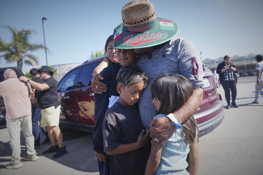 Authorities say about 200 immigrants were arrested in raids on 2 Southern California farms