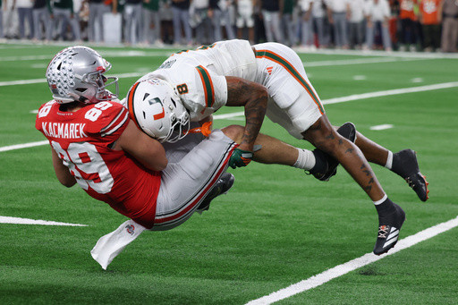 Defending champ Ohio State is out with loss to Miami