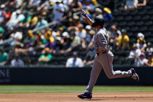 Rockies set club record for runs with 23-9 victory over A’s in Las Vegas heat
