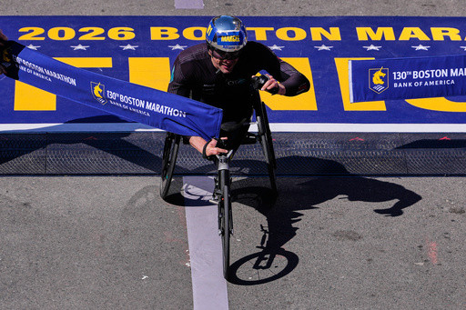 Switzerland great Marcel Hug claims his ninth Boston Marathon wheelchair title and fourth straight